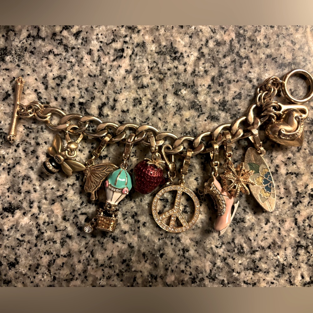 Beautiful juicy couture bracelet with 9 charms